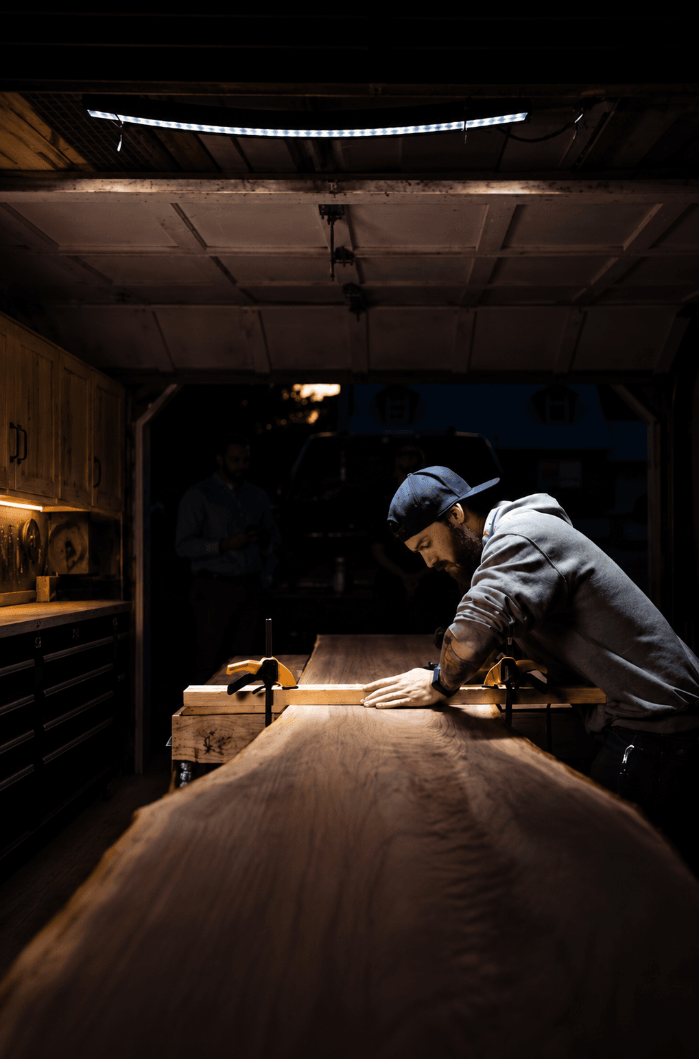 Travis Cain working in his shop late at night