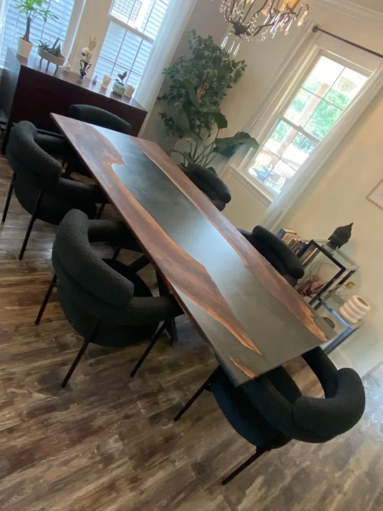Black epoxy river dining table with 8 chairs