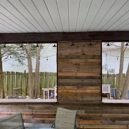 Reclaimed wood accent wall on screened porch