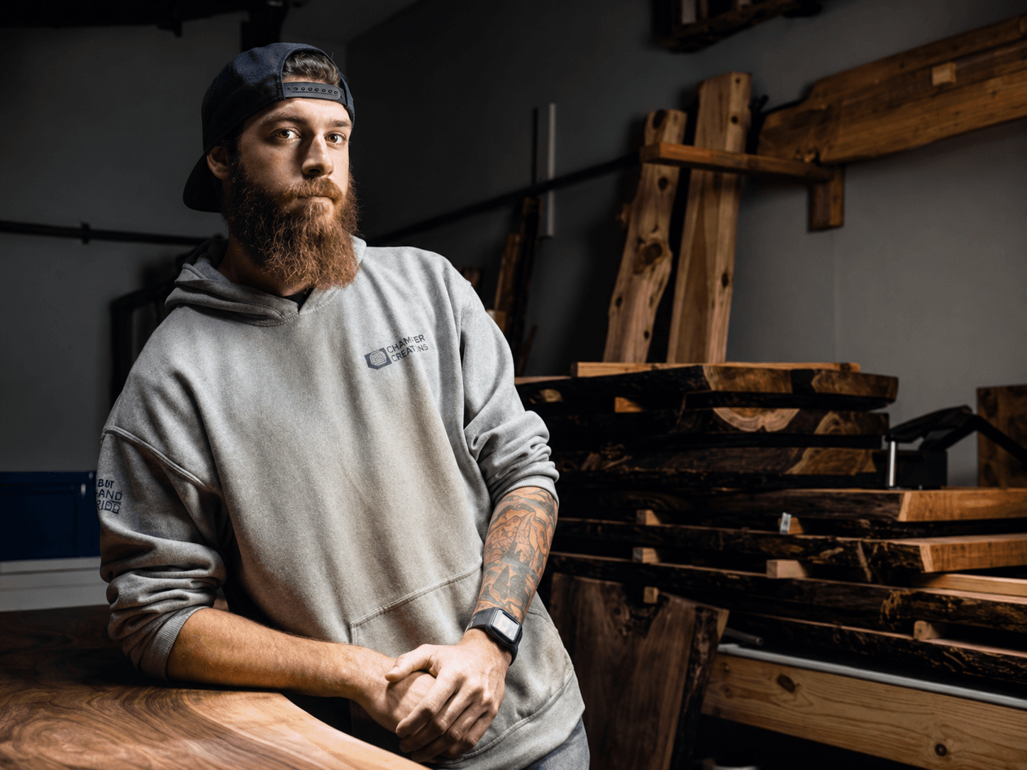 Travis Cain measuring a slab in his shop