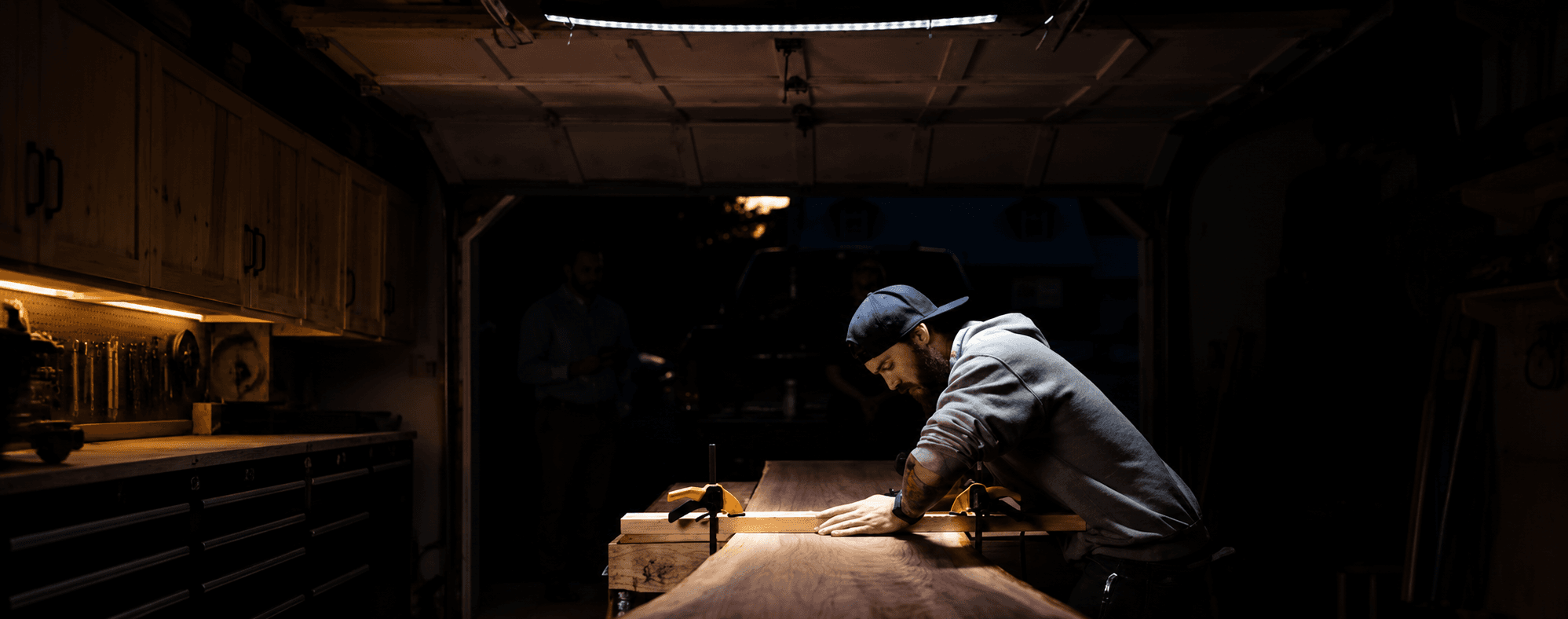 Travis Cain working in his shop late at night