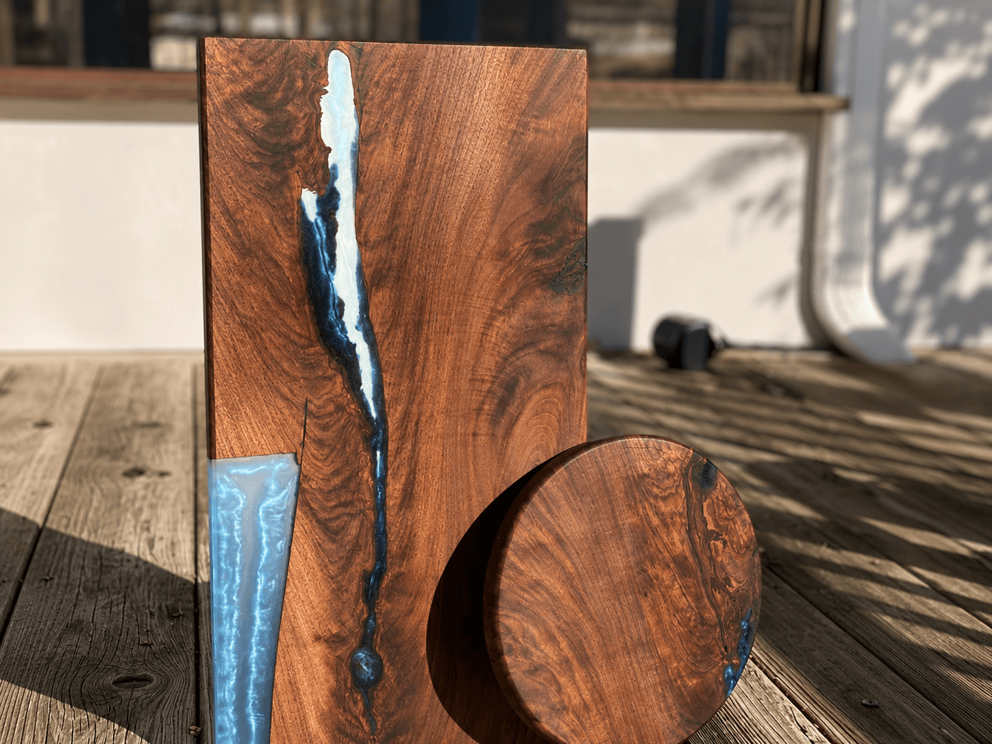 Black walnut charcuterie board and round with glacier blue epoxy